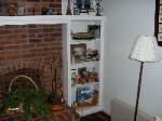 Next to fireplace alcove unit 5 feet tall